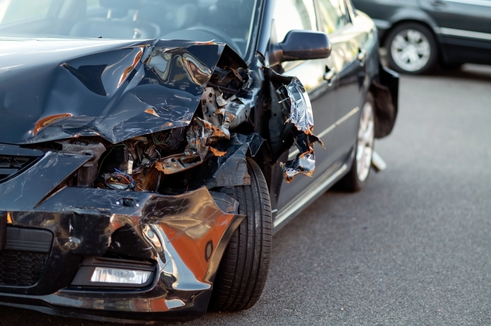 closeup-damaged-car-part-after-accident-showing-broken-metal-scratches